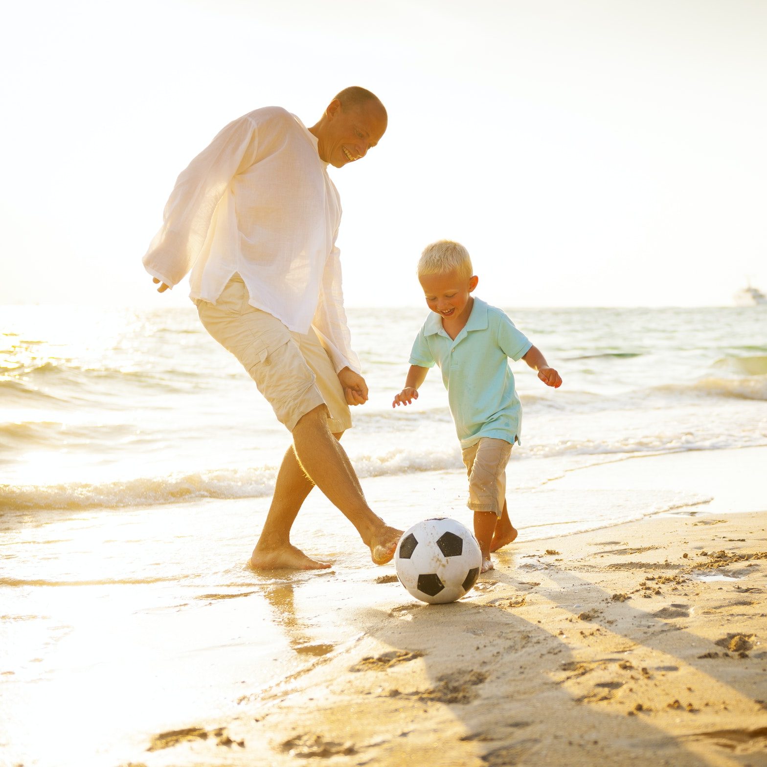 Family playing on the beach