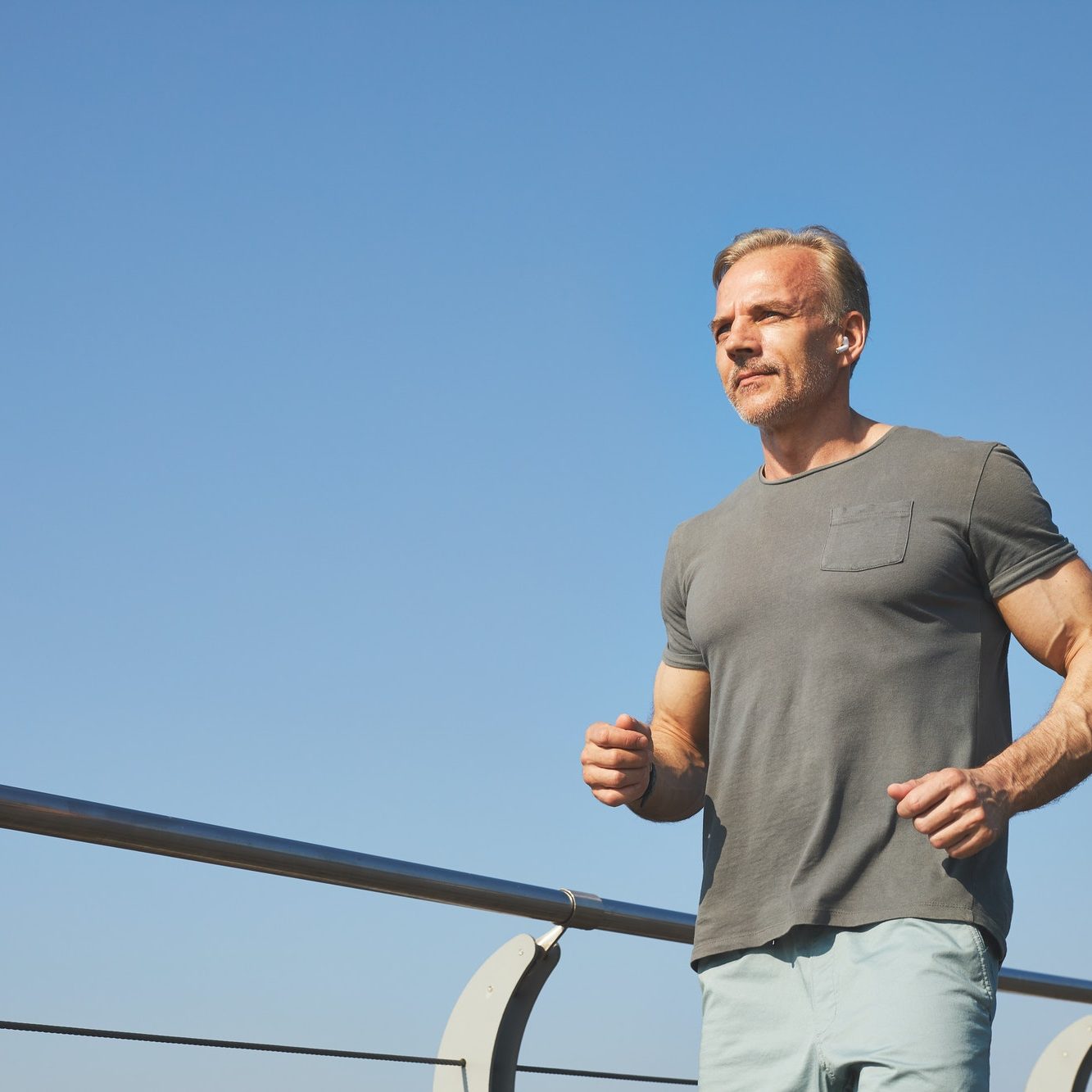 Active mature man running outdoors