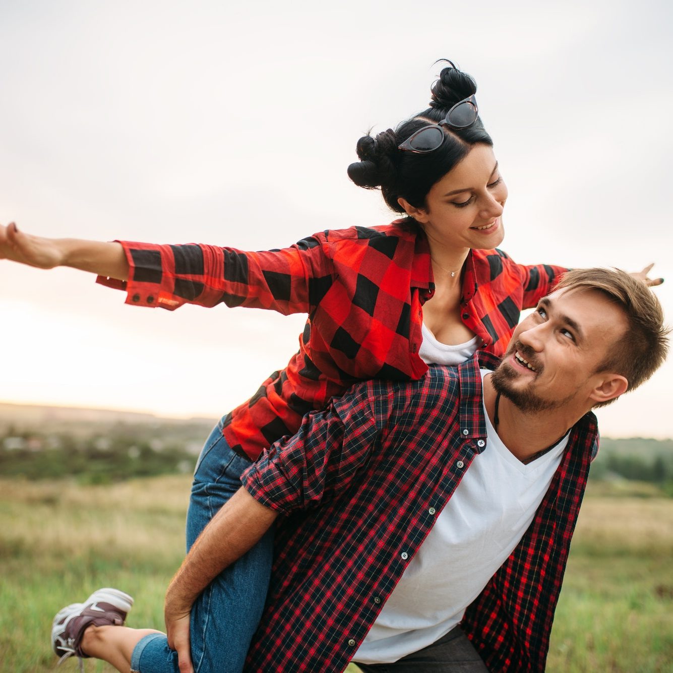 Couple leisure together, picnic in the field