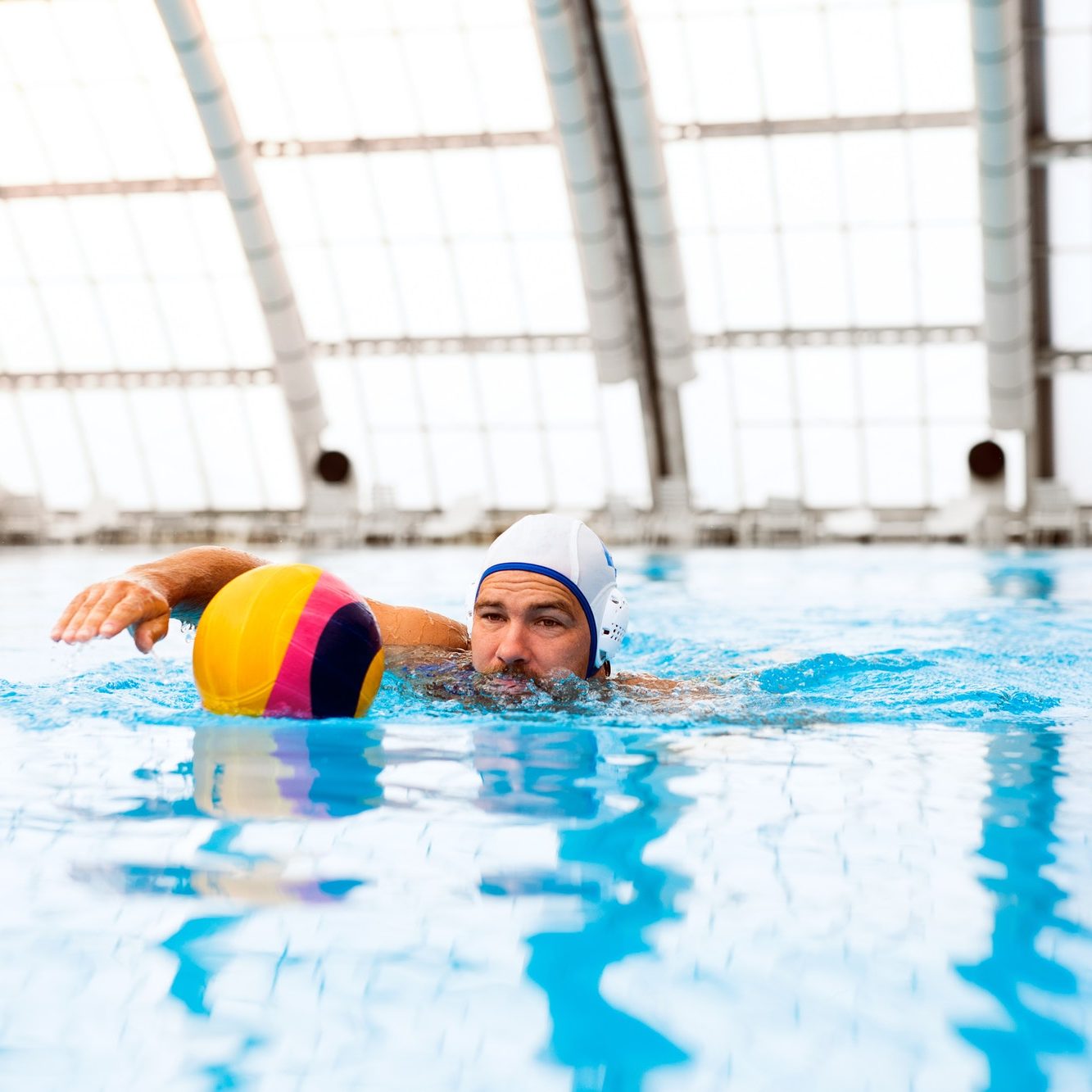 Water polo player in a swimming pool.